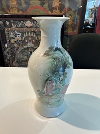 A Chinese famille rose baluster vase with figural design, six-character mark, 20th C.