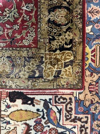 A Persian Isfahan silk rug with floral design, 20th C.