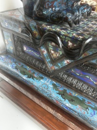A pair of Chinese cloisonn&eacute; Buddhist lions on a wooden base, 20th C.