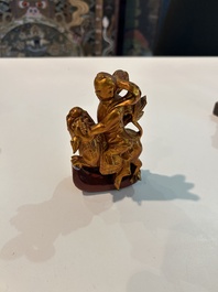 Eight Chinese gilt and polychromed wooden sculptures, 19th/20th C.