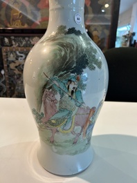 A Chinese famille rose baluster vase with figural design, six-character mark, 20th C.