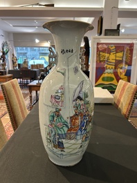 A pair of Chinese famille rose 'animated palace scene' vases, 19th/20th C.