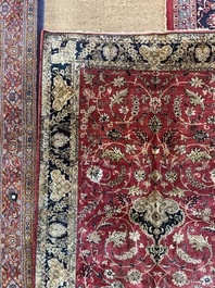 A Persian Isfahan silk rug with floral design, 20th C.