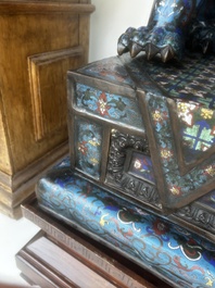 A pair of Chinese cloisonn&eacute; Buddhist lions on a wooden base, 20th C.