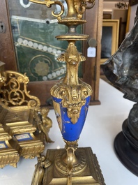 A French gilt bronze three-piece clock garniture crowned with a lady holding a jewelry box, 19th C.