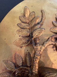 Paul Comolera (1813-1890): Plaque &agrave; d&eacute;cor en relief d'un oiseau sur une branche fleurie, bronze dor&eacute;