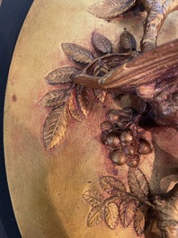 Paul Comolera (1813-1890): Plaque &agrave; d&eacute;cor en relief d'un oiseau sur une branche fleurie, bronze dor&eacute;