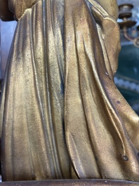 A French gilt bronze three-piece clock garniture crowned with a lady holding a jewelry box, 19th C.