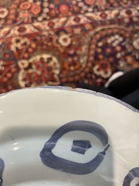 Three Dutch Delft blue and white chinoiserie plates, 17th/18th C.