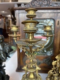 A French gilt bronze three-piece clock garniture crowned with a lady holding a jewelry box, 19th C.