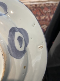 Three Dutch Delft blue and white chinoiserie plates, 17th/18th C.