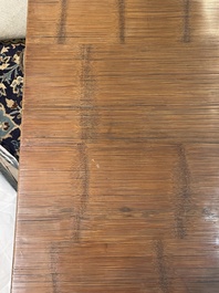 A Chinese bamboo and hardwooden opium table, 20th C.