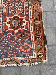 Een Perzisch Heriz tapijt met floraal decor, wol op katoen, 20ste eeuw