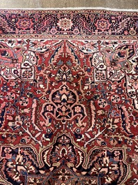 Een Perzisch Heriz tapijt met floraal decor, wol op katoen, 20ste eeuw