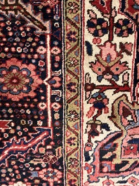 Een Perzisch Heriz tapijt met floraal decor, wol op katoen, 20ste eeuw