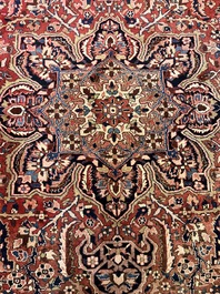 Een Perzisch Heriz tapijt met floraal decor, wol op katoen, 20ste eeuw