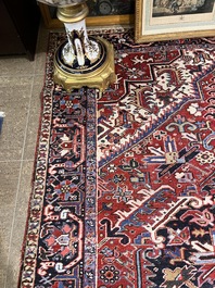 A Persian Heriz rug with floral design, wool on cotton, 20th C.