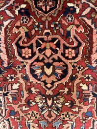 Een Perzisch Heriz tapijt met floraal decor, wol op katoen, 20ste eeuw