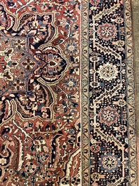 Een Perzisch Heriz tapijt met floraal decor, wol op katoen, 20ste eeuw