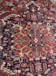 A Persian Heriz rug with floral design, wool on cotton, 20th C.
