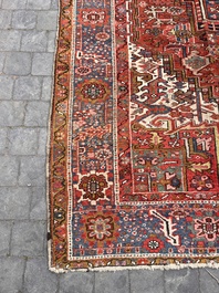 Een Perzisch Heriz tapijt met floraal decor, wol op katoen, 20ste eeuw