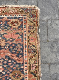 Een Perzisch Heriz tapijt met floraal decor, wol op katoen, 20ste eeuw