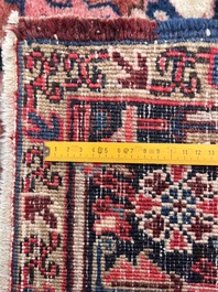 Een Perzisch Heriz tapijt met floraal decor, wol op katoen, eerste helft 20ste eeuw