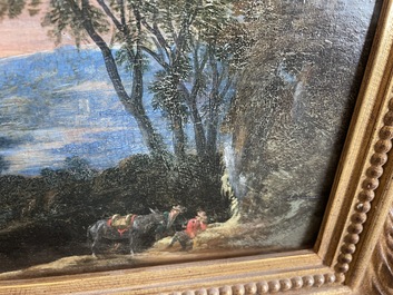 Flemish school: Two travelers and a donkey in a landscape, oil on panel, 17th C.