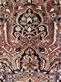 Een Perzisch Heriz tapijt met floraal decor, wol op katoen, 20ste eeuw