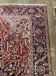 Een Perzisch Heriz tapijt met floraal decor, wol op katoen, 20ste eeuw