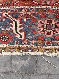 Een Perzisch Heriz tapijt met floraal decor, wol op katoen, 20ste eeuw