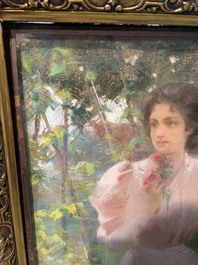 Louise De Hem (1866-1922): Portrait of a lady in a pink dress with a flower in her hand in a garden, pastel on paper marouflated on canvas