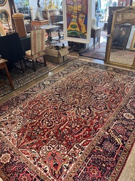 Een Perzisch Heriz tapijt met floraal decor, wol op katoen, 20ste eeuw