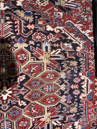 A Persian Heriz rug with floral design, wool on cotton, 20th C.