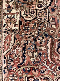 Een Perzisch Heriz tapijt met floraal decor, wol op katoen, 20ste eeuw