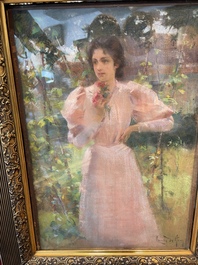 Louise De Hem (1866-1922): Portrait of a lady in a pink dress with a flower in her hand in a garden, pastel on paper marouflated on canvas