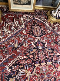 A Persian Heriz rug with floral design, wool on cotton, 20th C.
