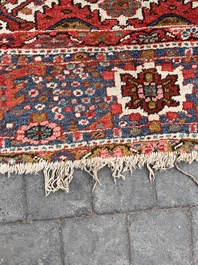 Een Perzisch Heriz tapijt met floraal decor, wol op katoen, 20ste eeuw