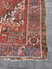 Een Perzisch Heriz tapijt met floraal decor, wol op katoen, 20ste eeuw