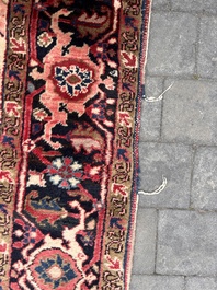 Een Perzisch Heriz tapijt met floraal decor, wol op katoen, eerste helft 20ste eeuw