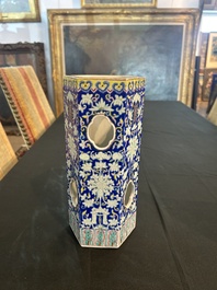 A Chinese reticulated hexagonal blue ground famille rose hatstand, 19th C.