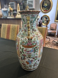 A pair of Chinese Canton famille rose vases with palace scenes and floral design, 19th C.