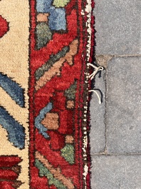 A Persian Bakhtiar rug with floral design, wool on cotton, 20th C.