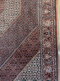 Een Perzisch Bidjar tapijt met floraal decor, wol op katoen, 20ste eeuw