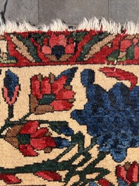 A Persian Bakhtiar rug with floral design, wool on cotton, 20th C.
