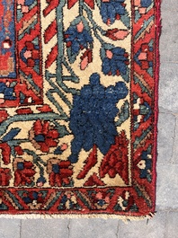 A Persian Bakhtiar rug with floral design, wool on cotton, 20th C.