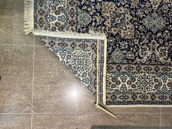 A Persian Nain rug with floral design, wool and silk on cotton, 20th C.