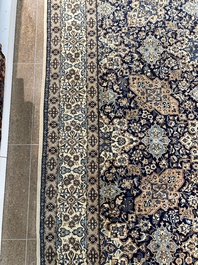 A Persian Nain rug with floral design, wool and silk on cotton, 20th C.