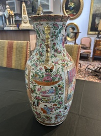 A pair of Chinese Canton famille rose vases with palace scenes and floral design, 19th C.