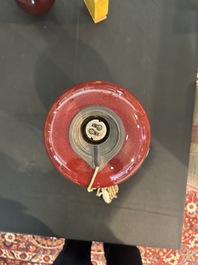 Trois vases en porcelaine monochrome jaune et sang-de-boeuf, un mont&eacute; en lampe, 19&egrave;me/20&egrave;me si&egrave;cle